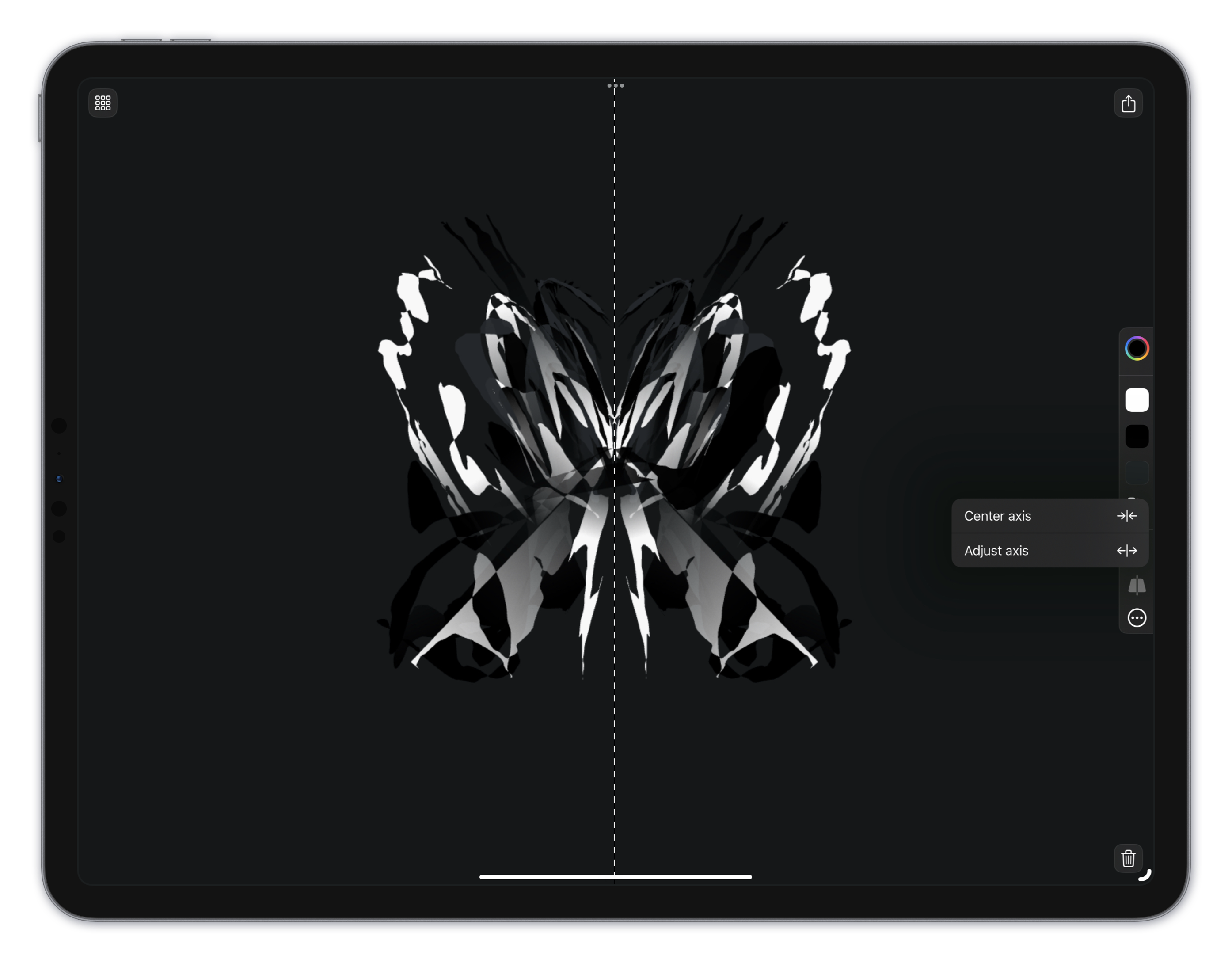 An iPad in landscape with a symmetrical black and white butterfly